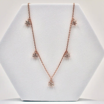 92.50 rose gold mini neckless with 5 Dimond flower hangings